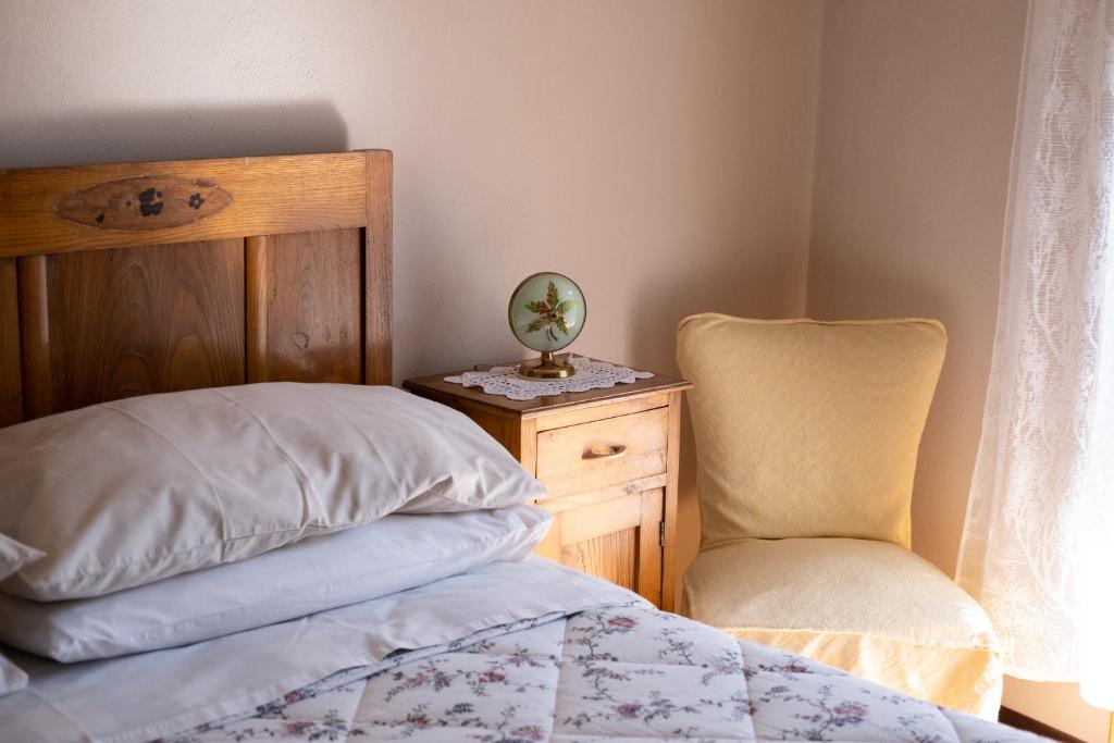 Postel nebo postele na pokoji v ubytování Locanda Genzianella
