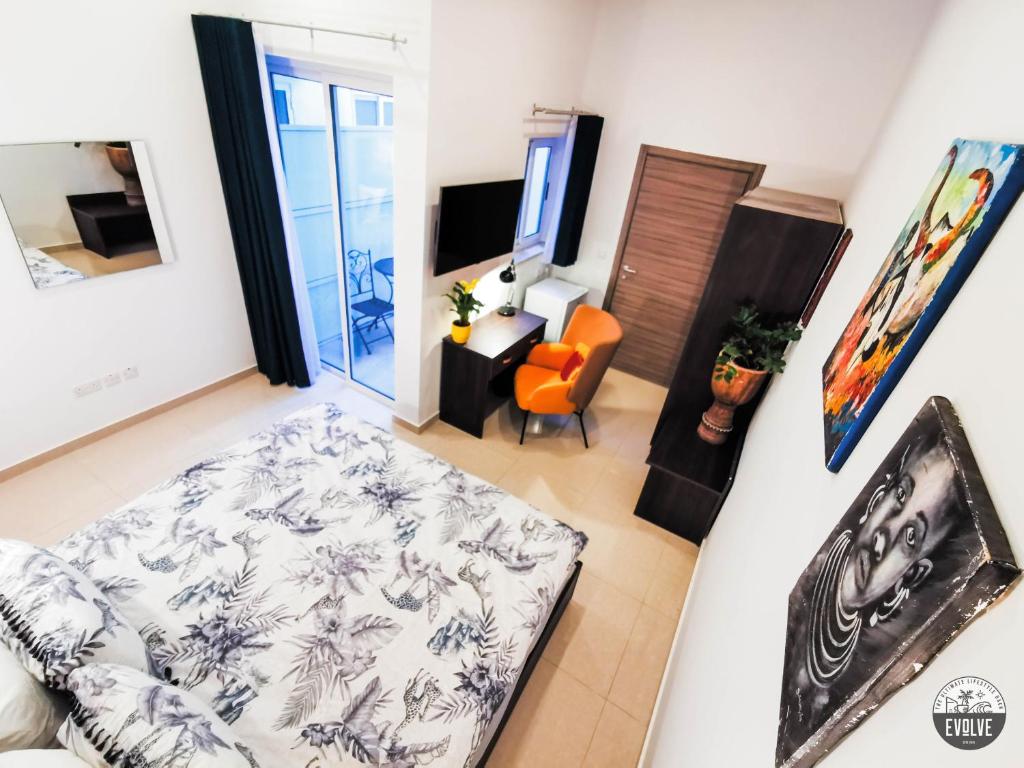 Postel nebo postele na pokoji v ubytování Evolve Coliving Guesthouse