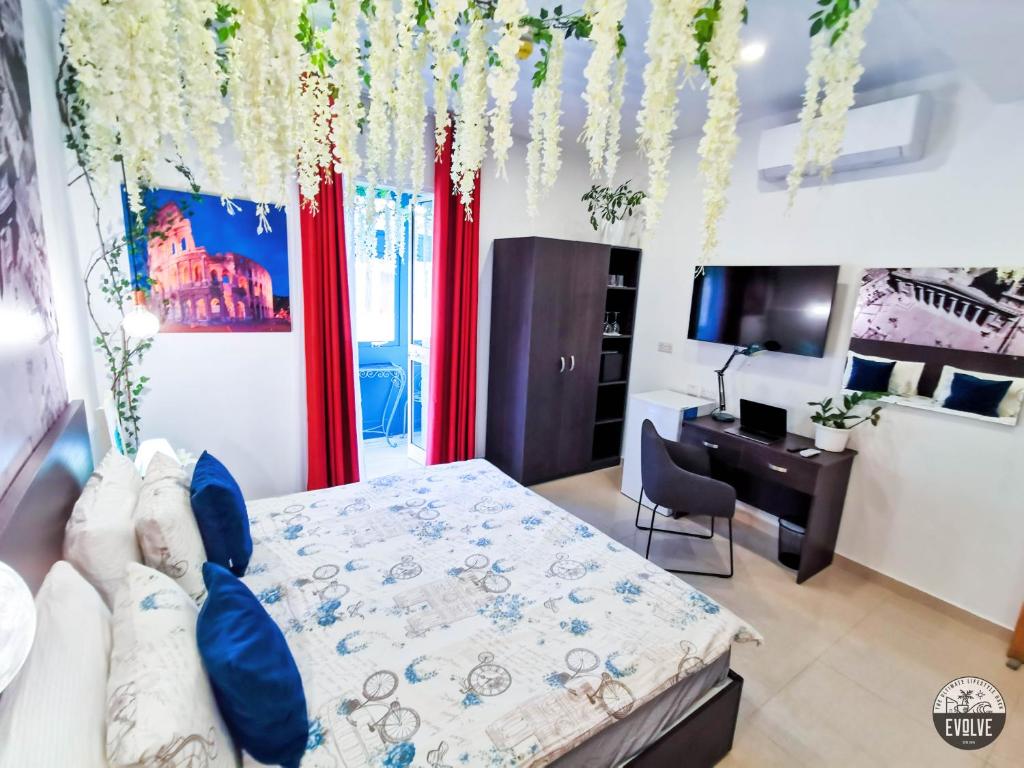 TV a/nebo společenská místnost v ubytování Evolve Coliving Guesthouse