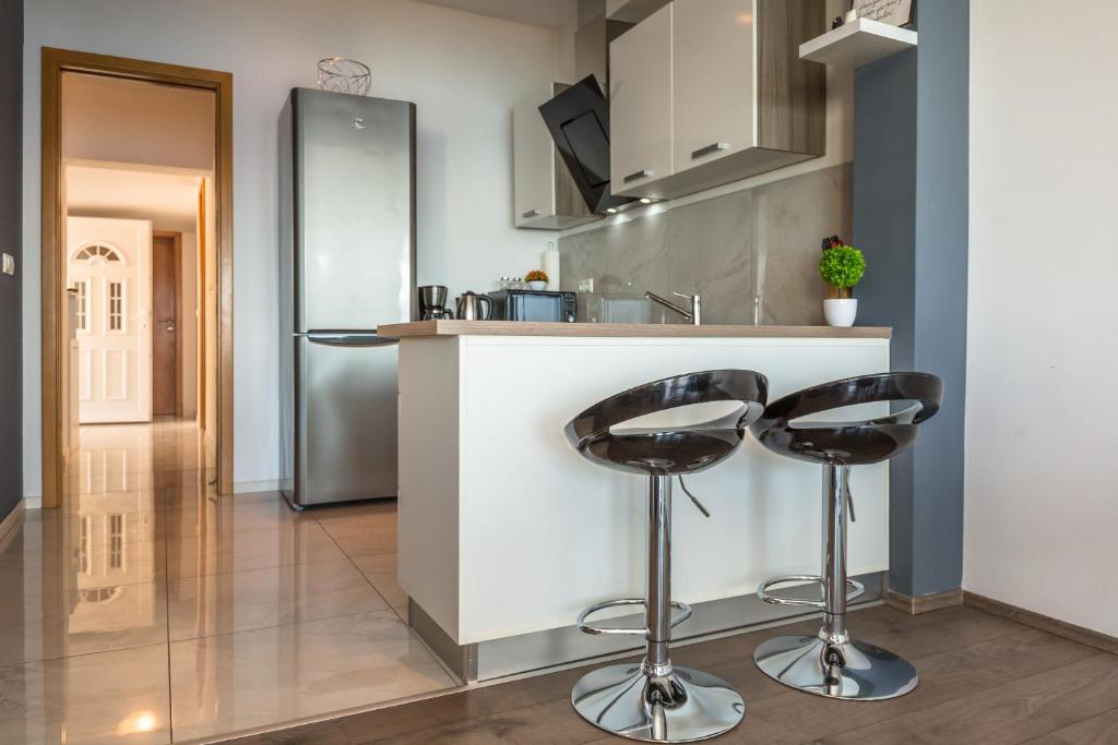 Kuchyňa alebo kuchynka v ubytovaní MODERN apartment OMIS