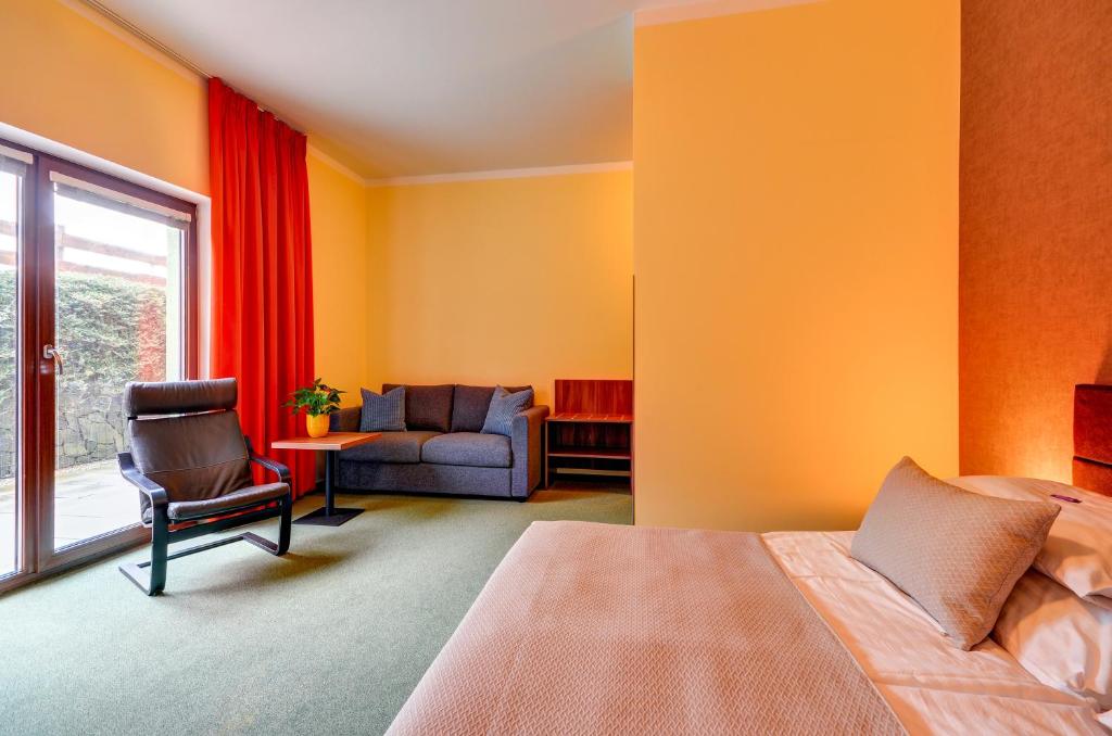 Postel nebo postele na pokoji v ubytování Hotel Hermes