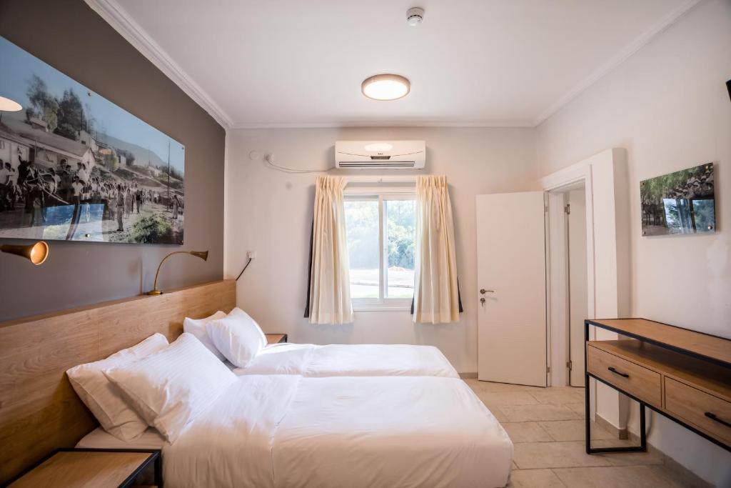 Postel nebo postele na pokoji v ubytování איילת השחר אירוח גלילי - Ayelet Hotel