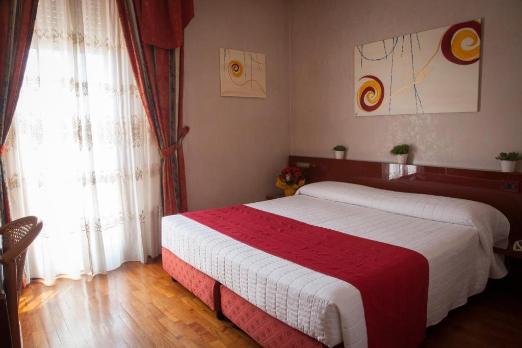 Postel nebo postele na pokoji v ubytování Hotel Master