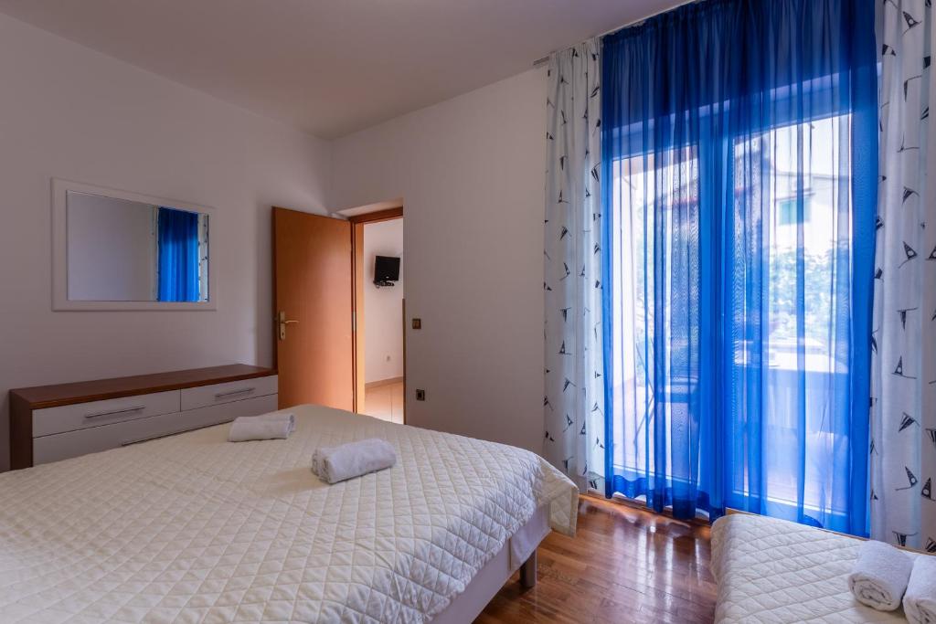 Postel nebo postele na pokoji v ubytování Apartments Zdena