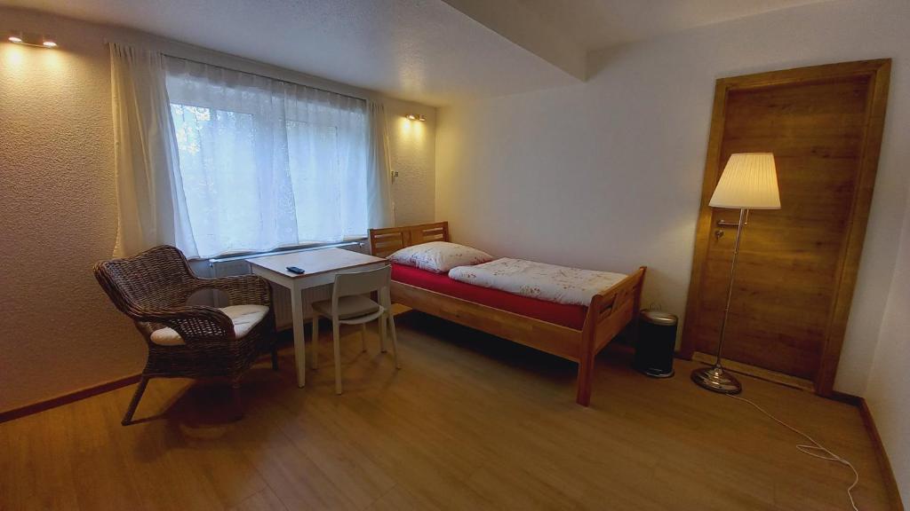 Postel nebo postele na pokoji v ubytování Waldpension Harzer Waldwinkel