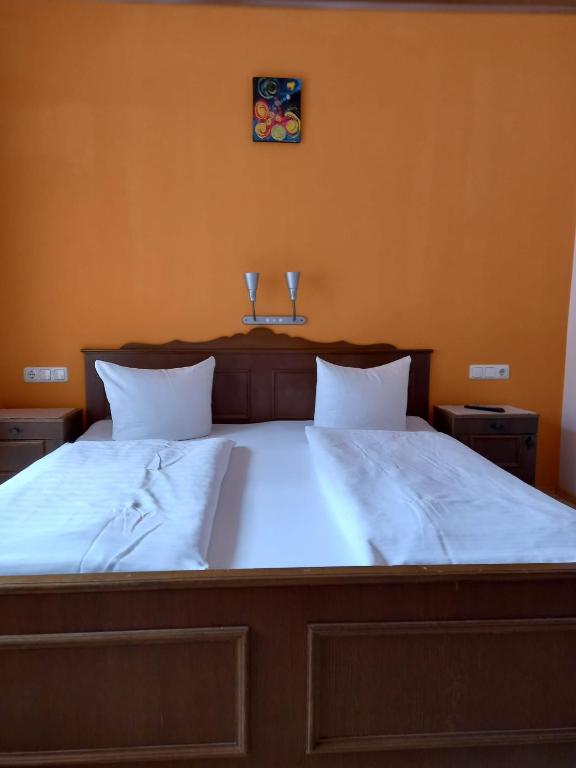 מיטה או מיטות בחדר ב-Gasthof zum Pfandl
