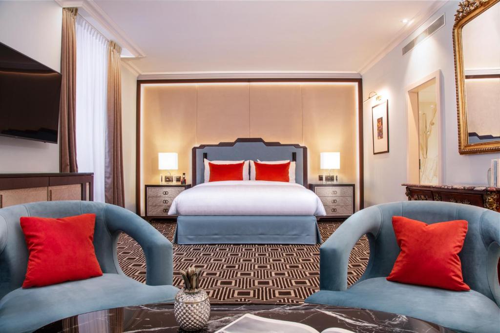 Postel nebo postele na pokoji v ubytování Hotel Bristol