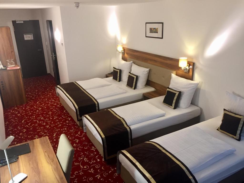 Postel nebo postele na pokoji v ubytování Hotel Luna