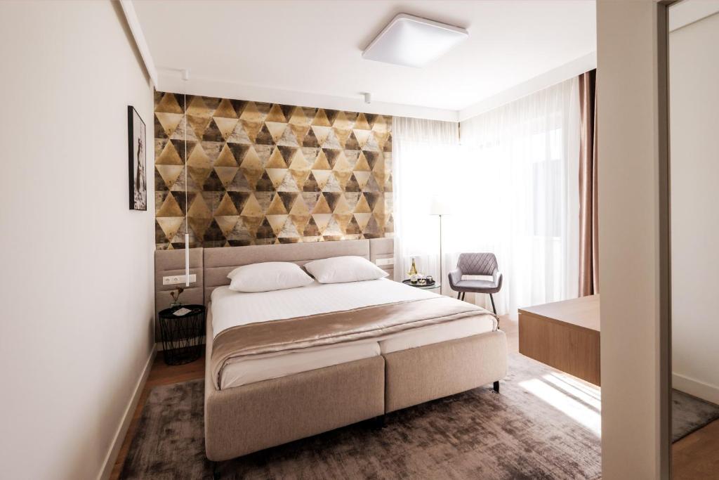 Posteľ alebo postele v izbe v ubytovaní Adele Apartments