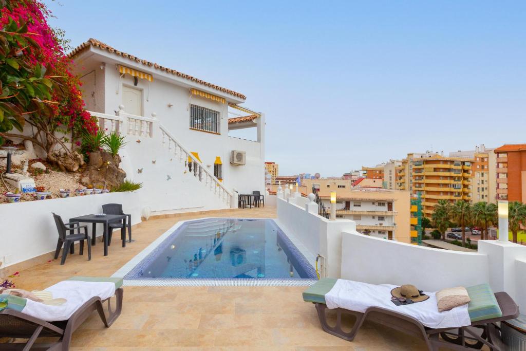 a villa with a swimming pool on top of a building at Villa Mar del Plata 8 bed apartment in Fuengirola