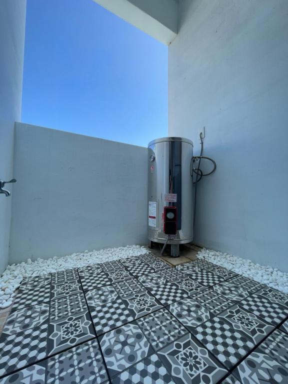 a bathroom with a thermospacistacist at It's Mine Hostel in Taitung City