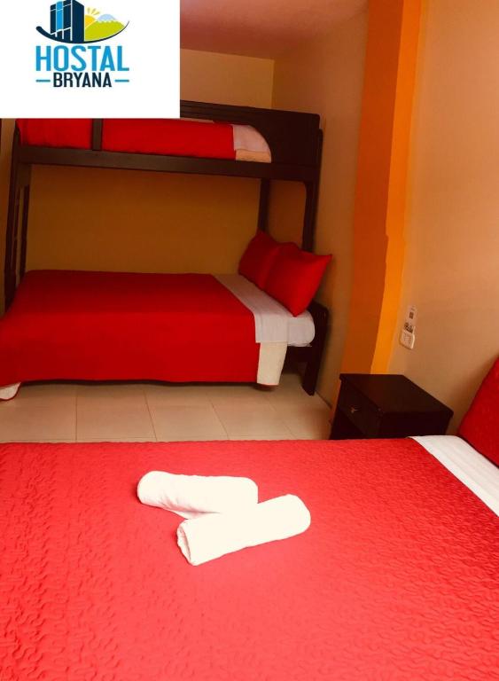 Postel nebo postele na pokoji v ubytování Hostal Bryana Inn Baños