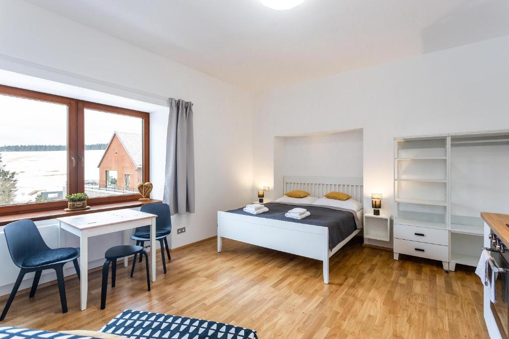 Postel nebo postele na pokoji v ubytování U Pivovaru - Apartments Boží Dar