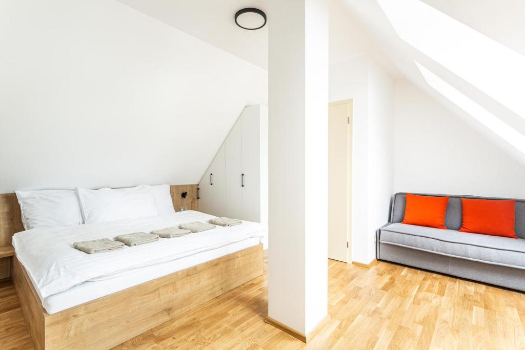 Postel nebo postele na pokoji v ubytování U Pivovaru - Apartments Boží Dar