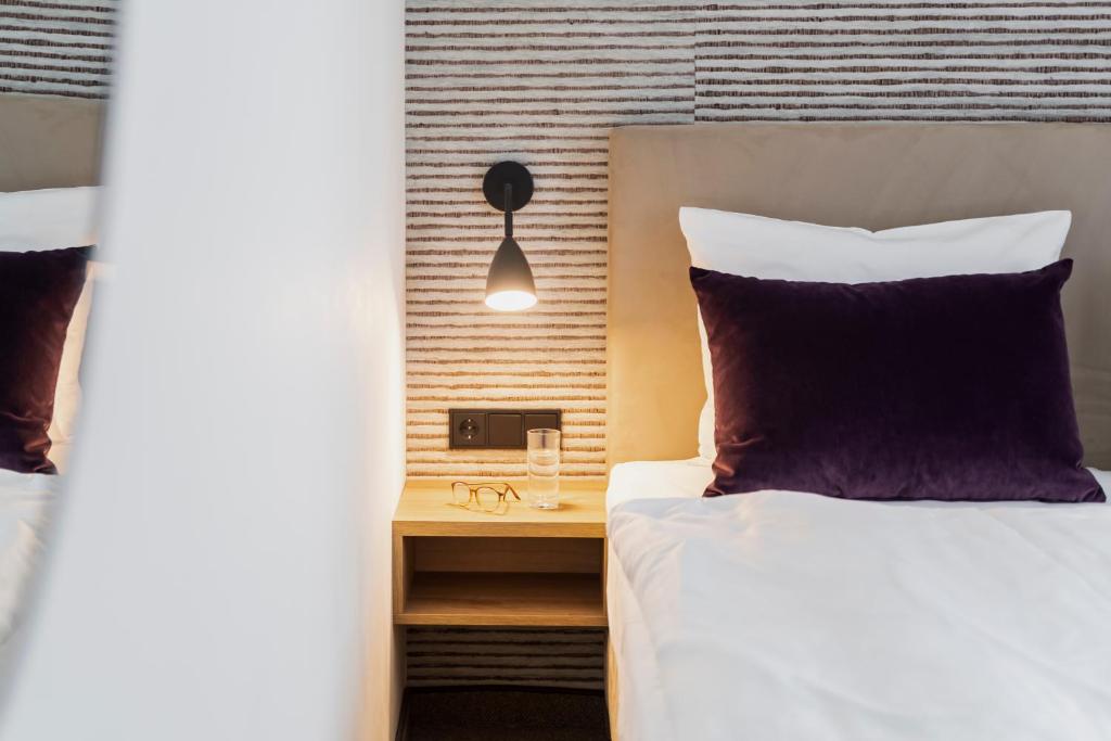 Postel nebo postele na pokoji v ubytování maakt Hotel