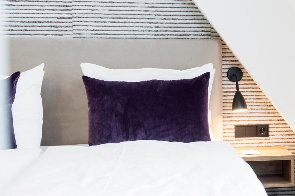Postel nebo postele na pokoji v ubytování maakt Hotel