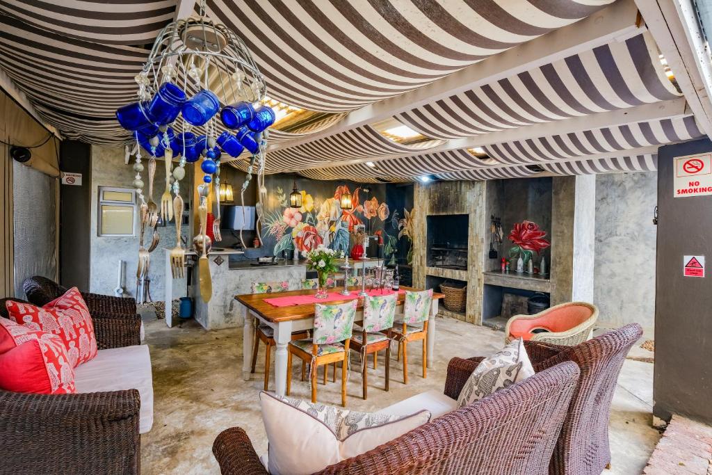 a dining room with a table and chairs at Rose Acres Guest House in Parys