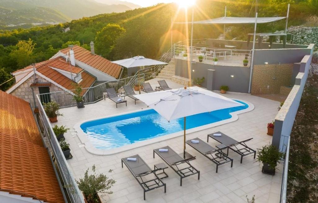an image of a villa with a swimming pool at Villa Vito - with heated pool, whirlpool, gym in Šarići