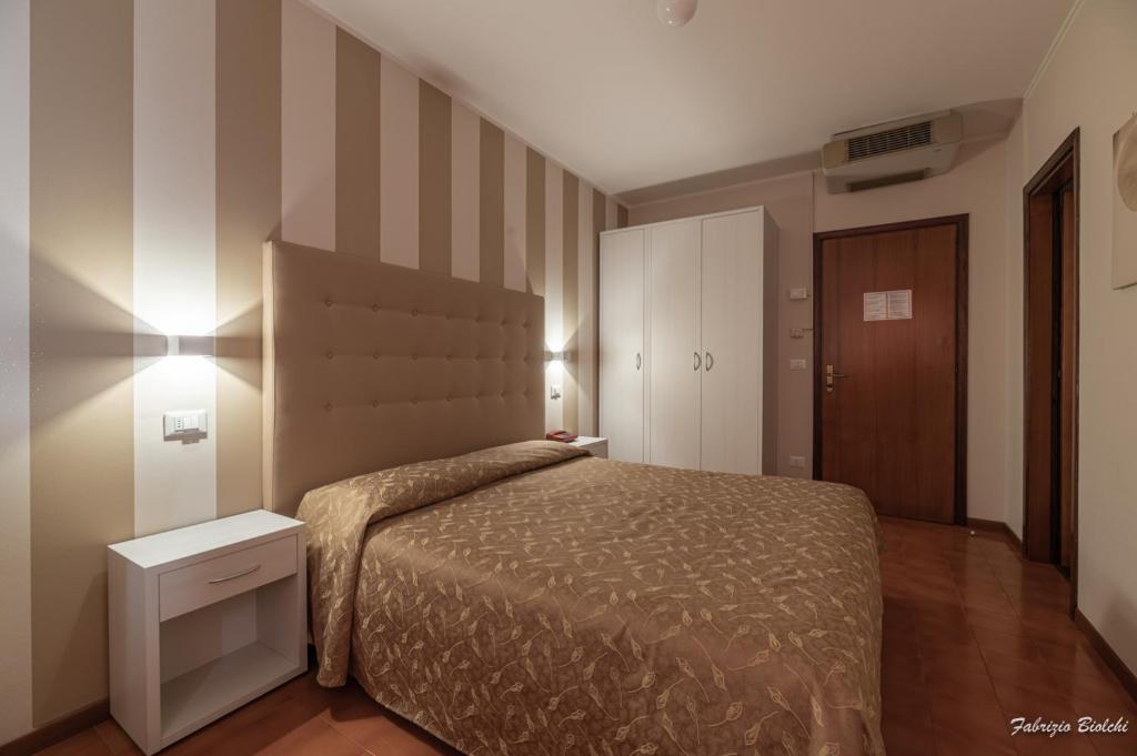 Postel nebo postele na pokoji v ubytování Albergo Bagner