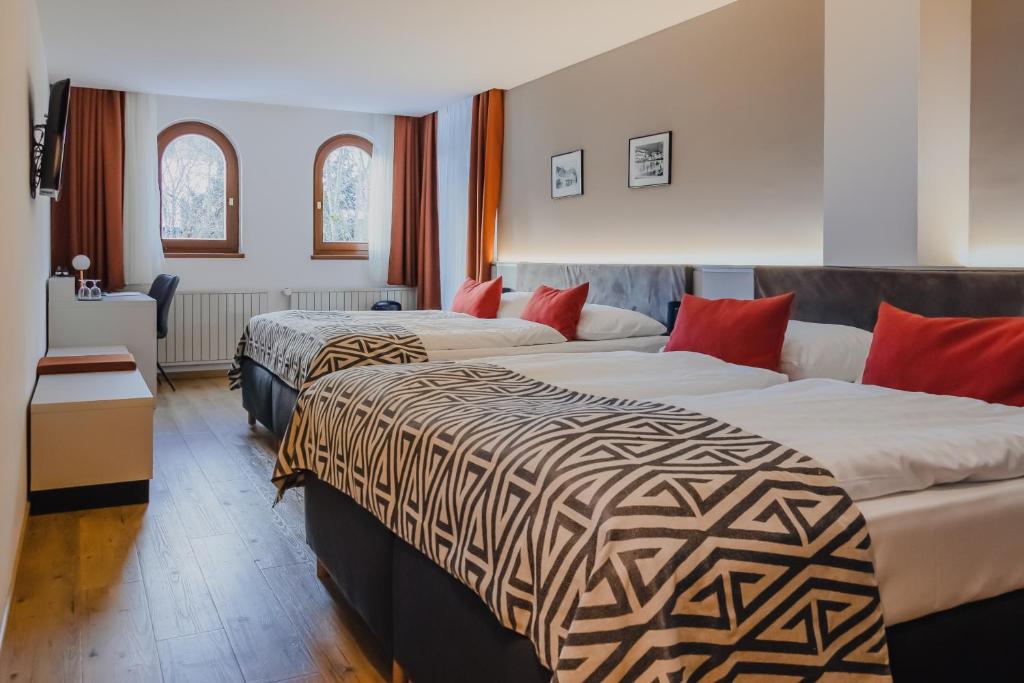 Postel nebo postele na pokoji v ubytování Hotel Alpenblick Kreischberg