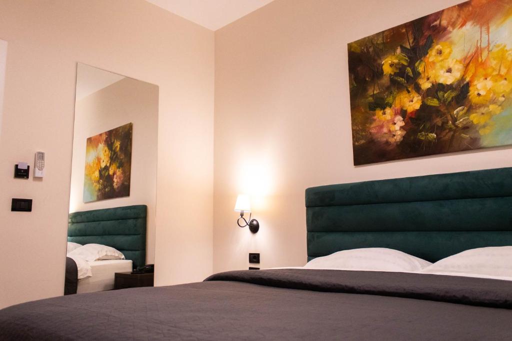 Postel nebo postele na pokoji v ubytování Venis Hotel