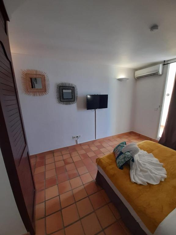 Postel nebo postele na pokoji v ubytování Appartements vue mer - Résidence de la baie - Tartane