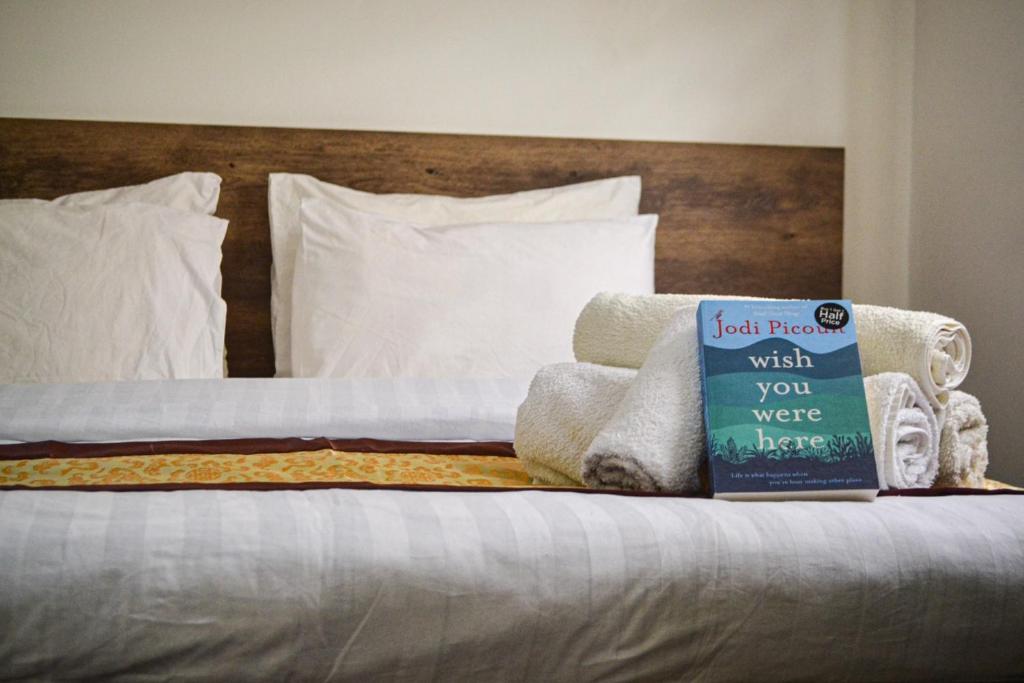 Postel nebo postele na pokoji v ubytování Hikaya studios