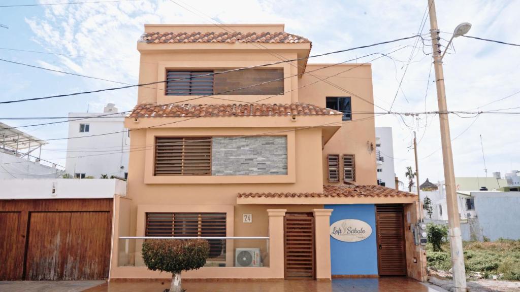 a house in the middle of a street at Loft Sabalo - Pet Friendly in Mazatlán