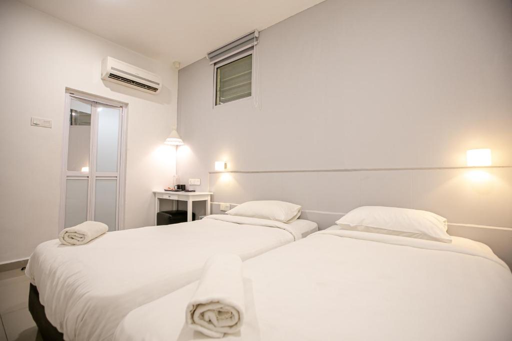 Postel nebo postele na pokoji v ubytování Grand Swiss Hotel