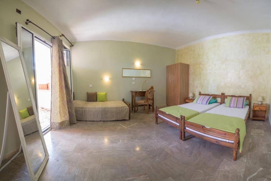 Postel nebo postele na pokoji v ubytování Efi Apartments