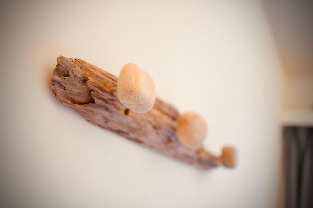 a piece of wood with two knobs on it at It's Mine Hostel in Taitung City