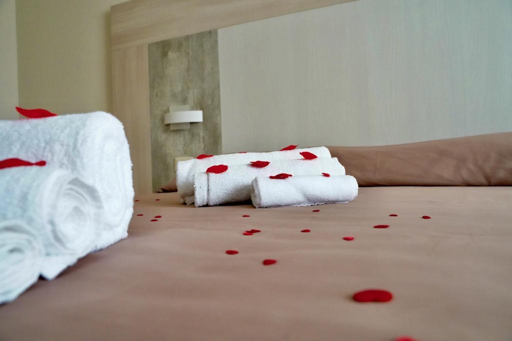 Posteľ alebo postele v izbe v ubytovaní Hotel Roscianum Welness SPA