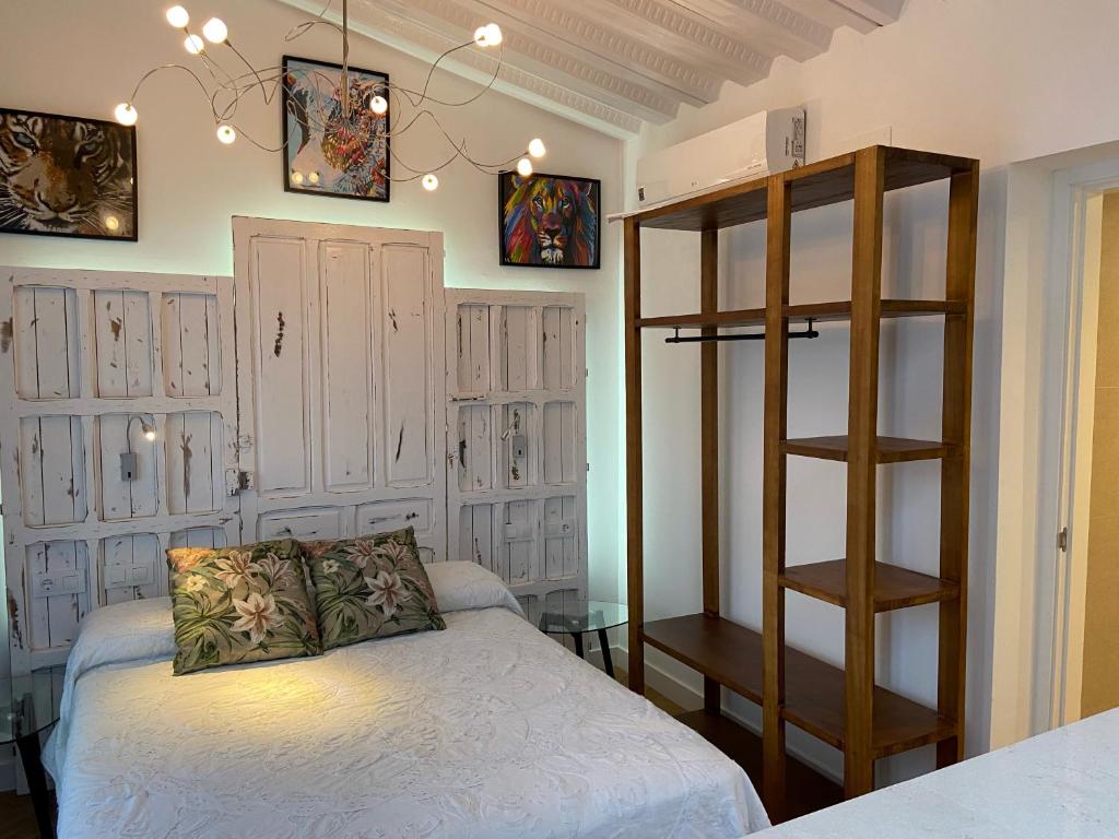Postel nebo postele na pokoji v ubytování CASA NAIA Santa Rufina 7