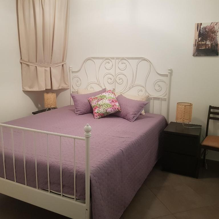 Postel nebo postele na pokoji v ubytování Apartmani Afrodita