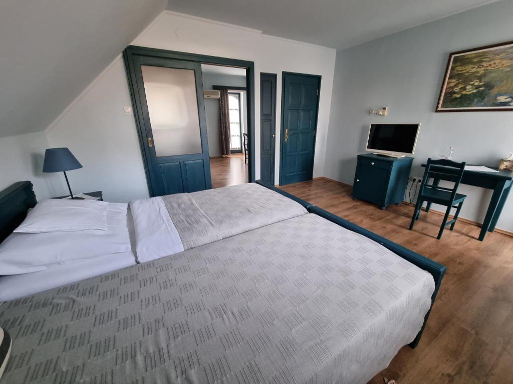 Postel nebo postele na pokoji v ubytování BB Boutique Hotel