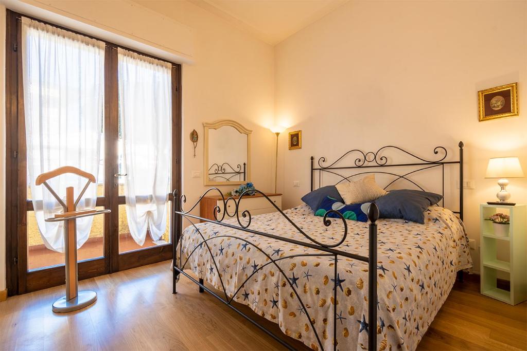 En eller flere senger på et rom på Appartamento di Elizabeth