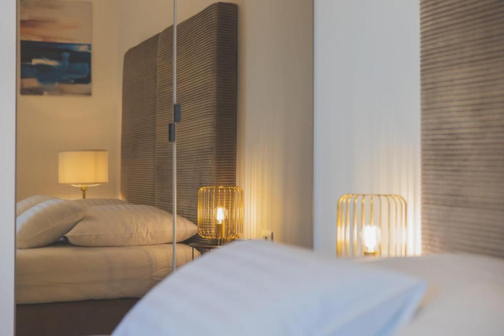 Posteľ alebo postele v izbe v ubytovaní Perla Luxury Apartment