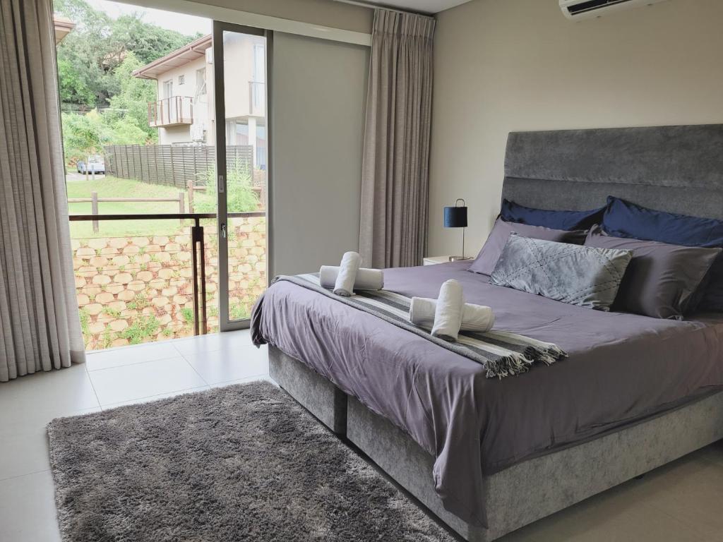 Vuode tai vuoteita majoituspaikassa Cheerful 3-bedroom home in Zimbali Wedge Estate