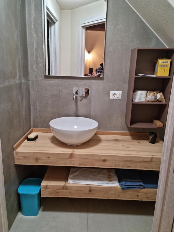 a bathroom with a sink and a mirror at LANGHE PARADISOT in Niella Belbo