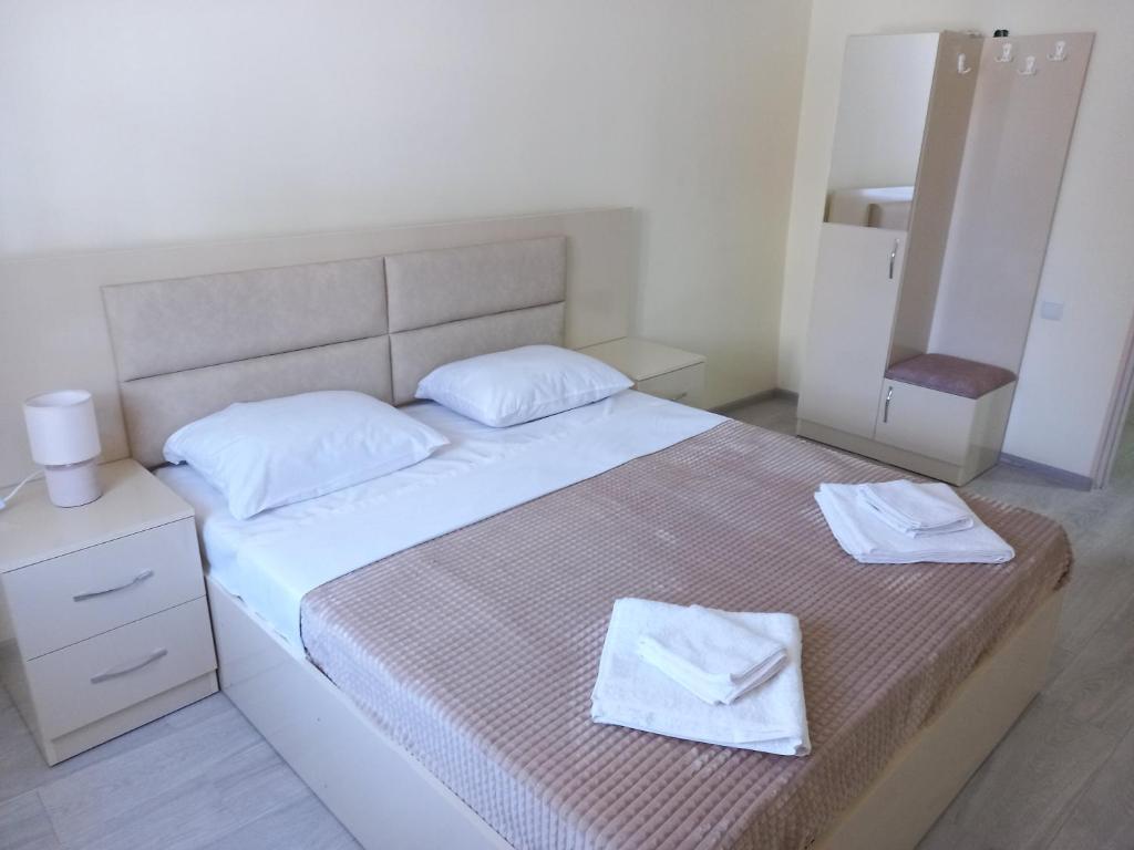 Postel nebo postele na pokoji v ubytování H.A.S.K