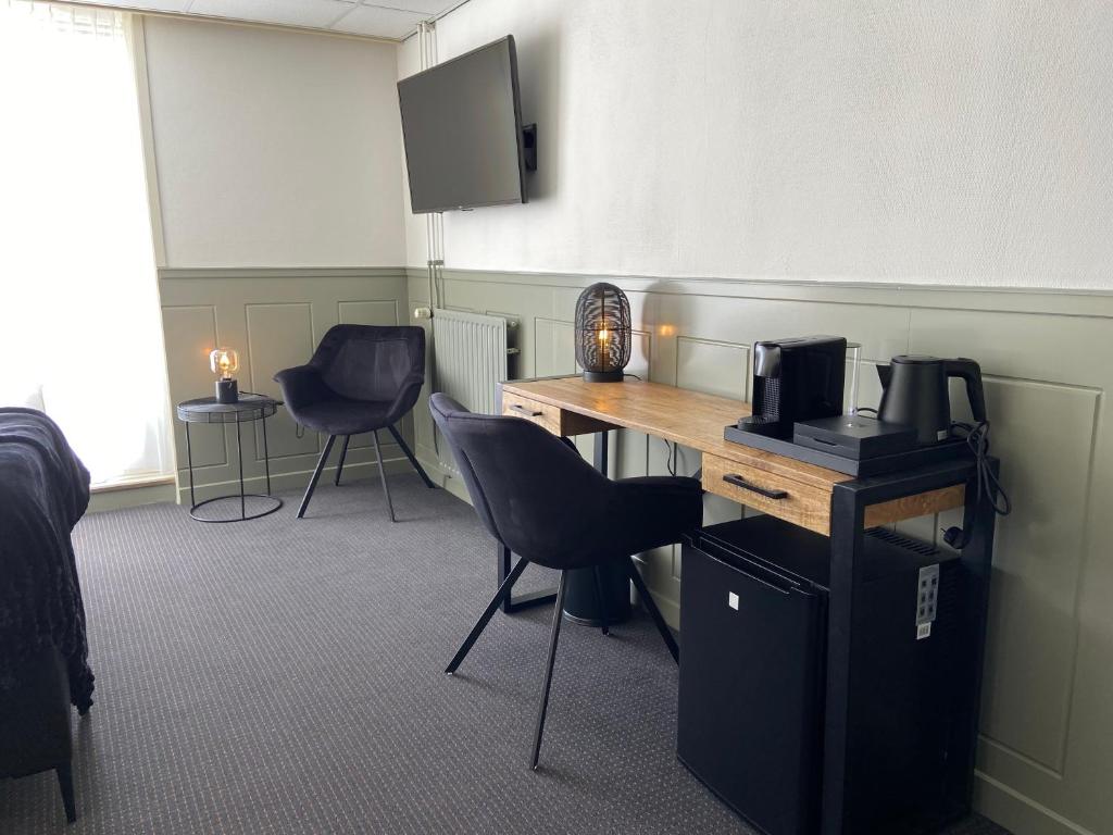 TV a/nebo společenská místnost v ubytování Hotel Beatrix