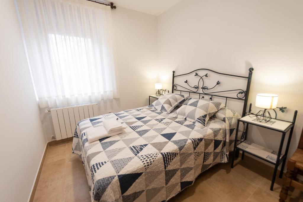 Postel nebo postele na pokoji v ubytování VuT El Pozo la Carrera 2