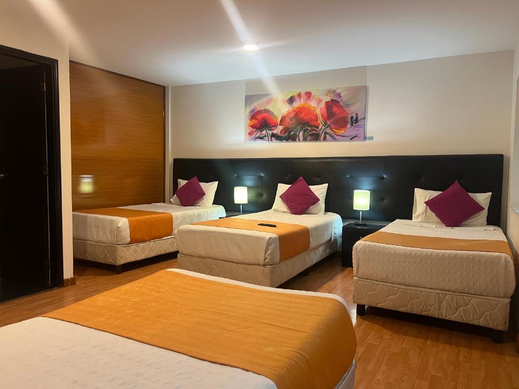 Postel nebo postele na pokoji v ubytování Hotel Ferias Park
