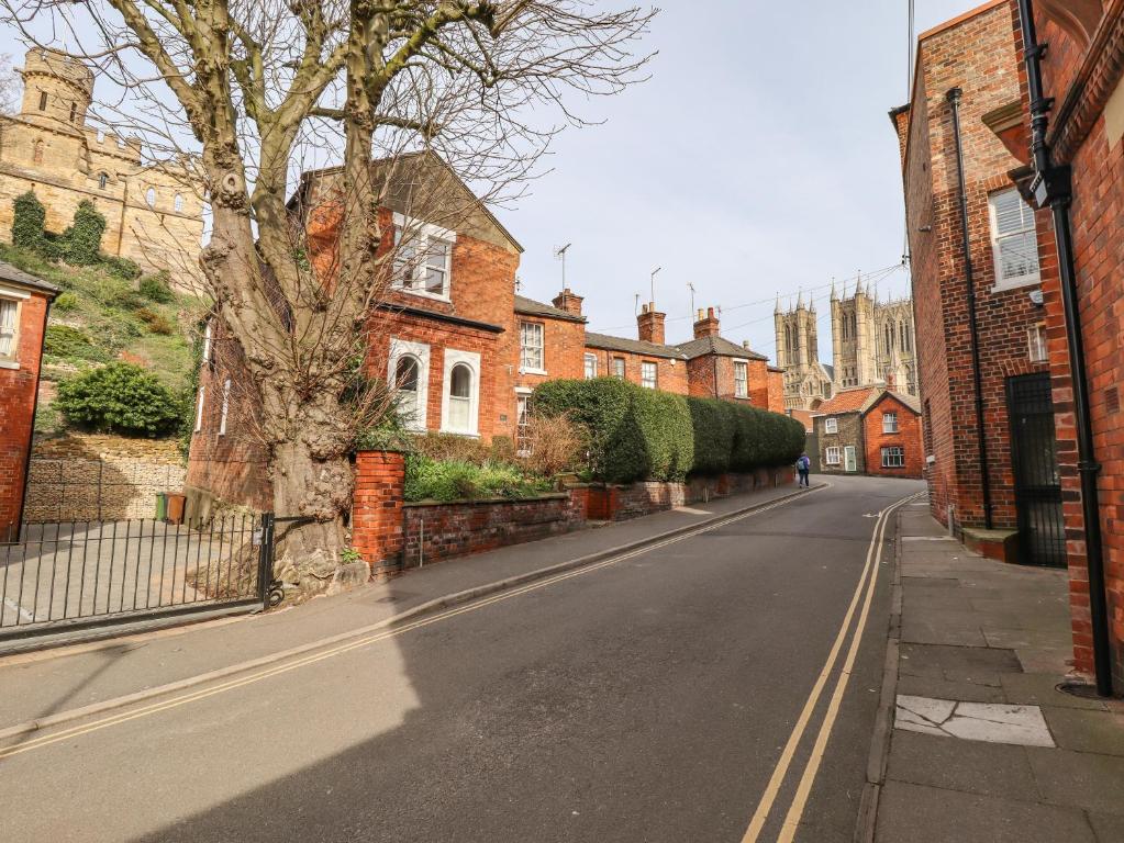 an empty street in a town with brick houses at Castlegate House in Lincoln