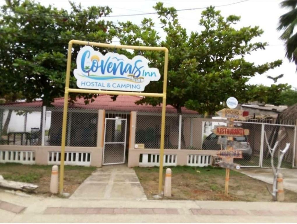 a sign in front of a museum and camping at HOSTAL COVEÑAS INN in Coveñas