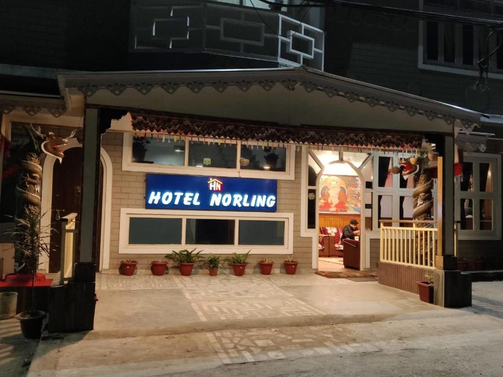 a store with a sign on the front of it at Hotel Norling SK Groups in Pelling
