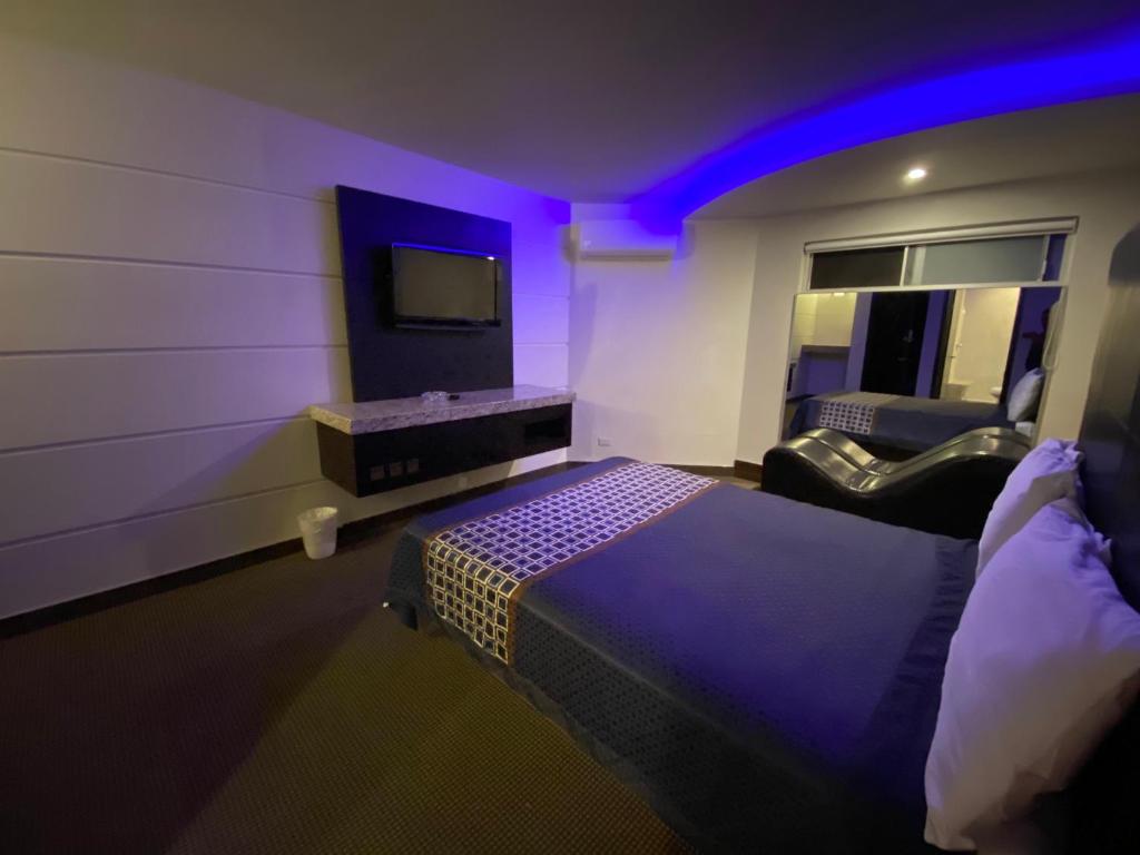 TV a/nebo společenská místnost v ubytování Motel Encuentro