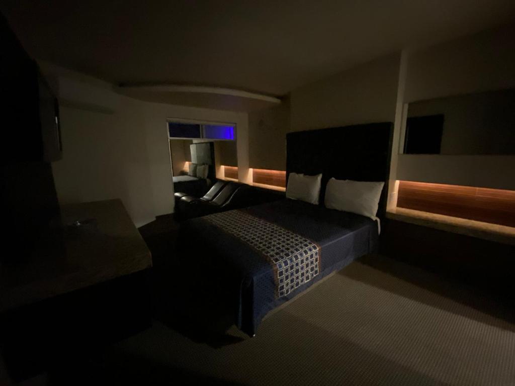 Giường trong phòng chung tại Motel Encuentro