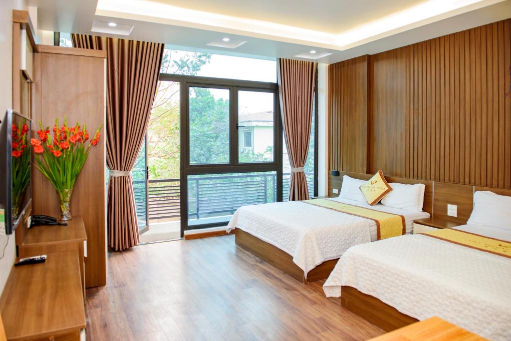 Ένα ή περισσότερα κρεβάτια σε δωμάτιο στο Viet Phuong Hotel Ninh Binh