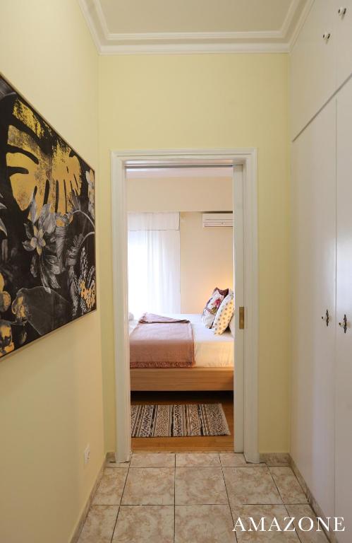 Postel nebo postele na pokoji v ubytování MELMA PROPERTIES-AMAZONE-premium apartment in Piraeus center